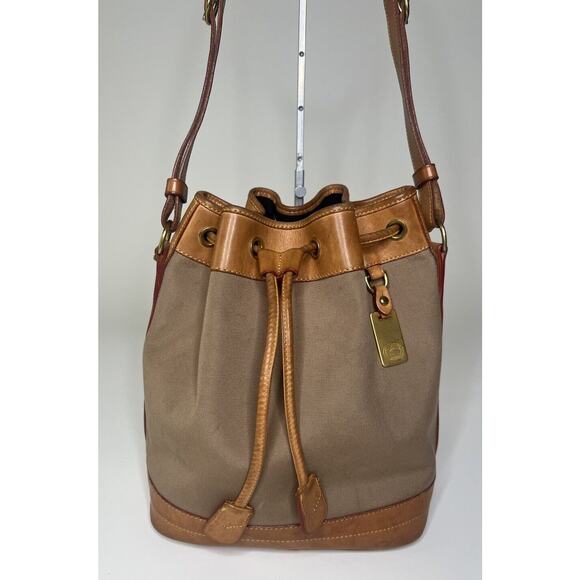 Vintage Dooney & Bourke Bucket Bag Tan Canvas Leather Drawstring Shoulder Tote - Picture 1 of 11